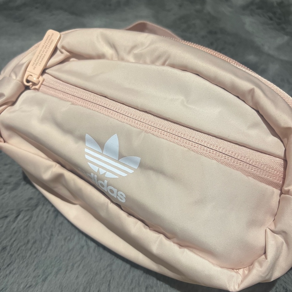 Light pink Adidas belt bag